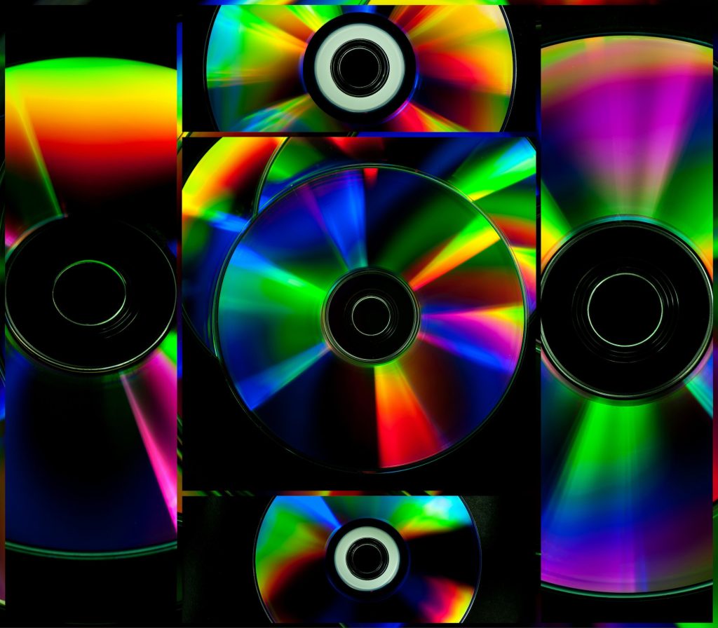 Collage colorful CD and DVD computer disks