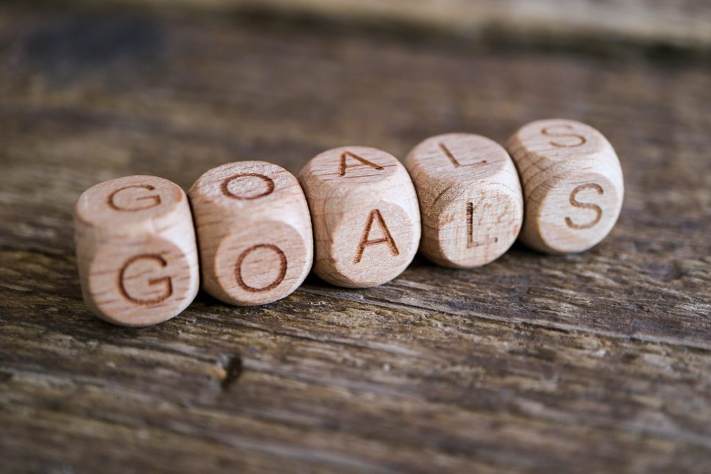 Goals word on wooden cubes. New year goals, plan, action, strategy, resolutions, business