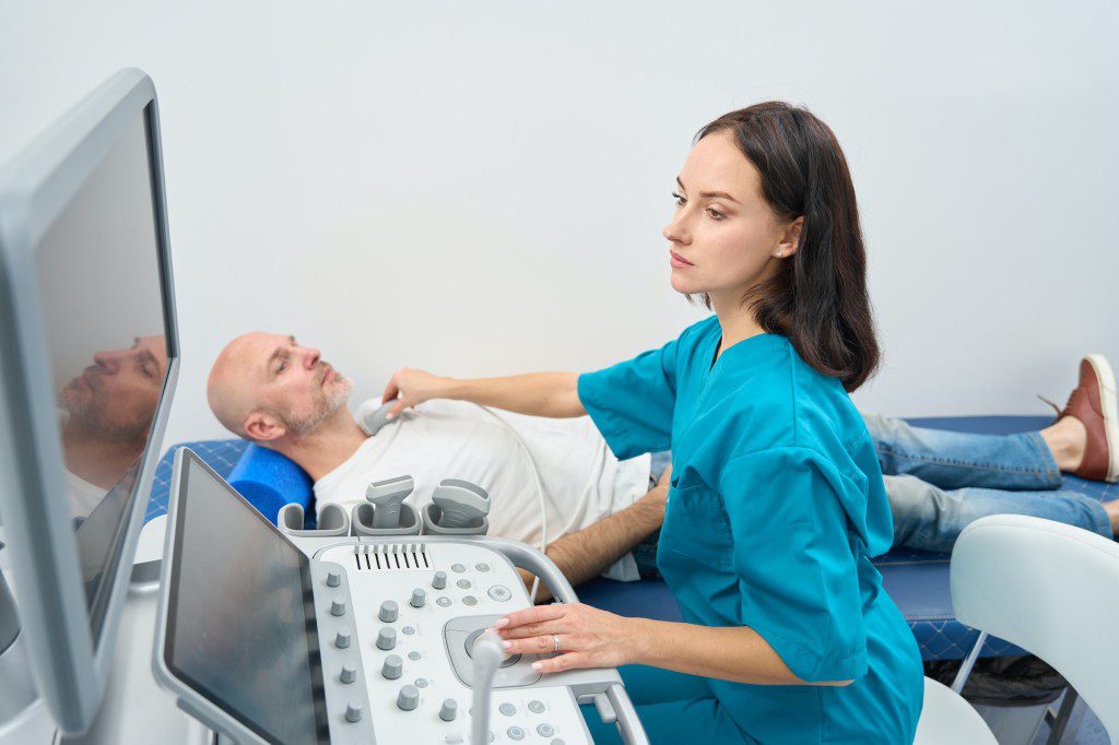 Close up of man undergoing an electrocardiogram procedure