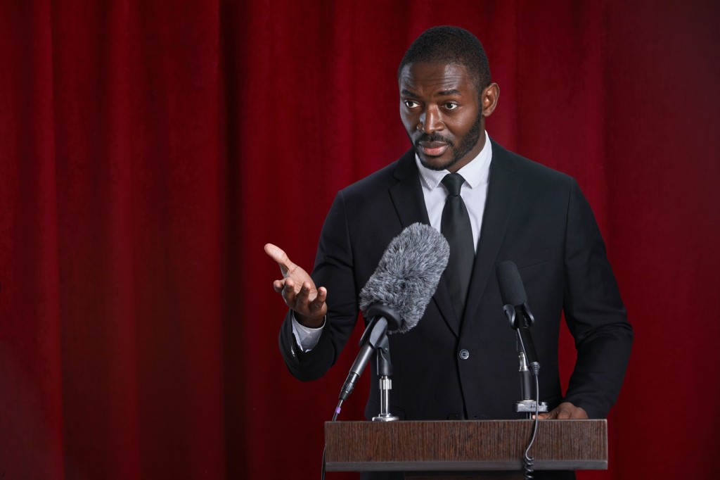 African-American Public Speaker on Stage