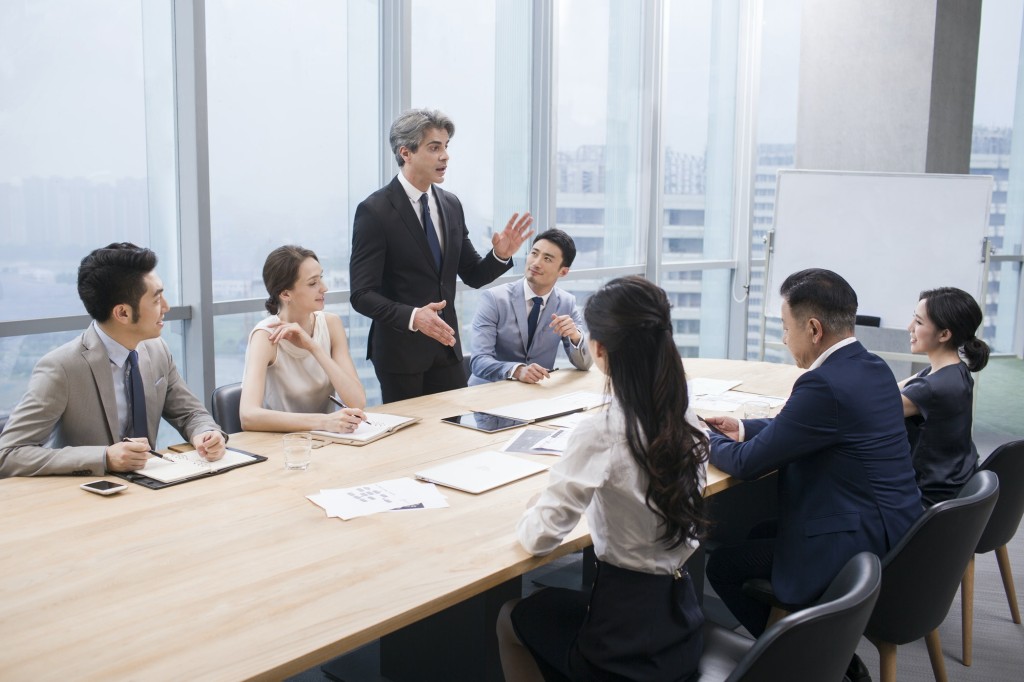 Business people having meeting in board room