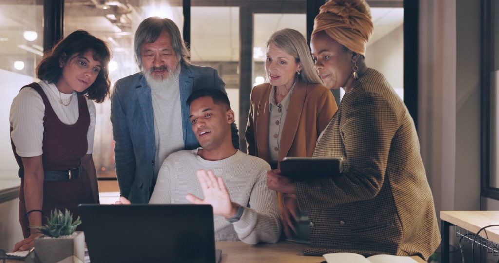 Laptop, tablet and business people teamwork on night project, digital finance portfolio or feedback