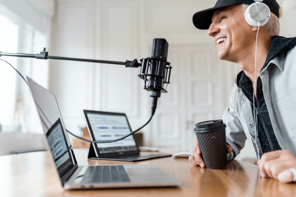 The presenter works on the radio, online communication broadcast.