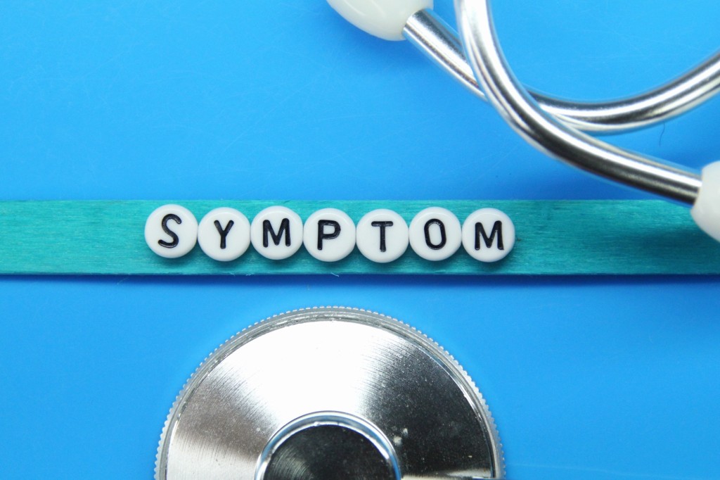 stethoscope with the word symptom.