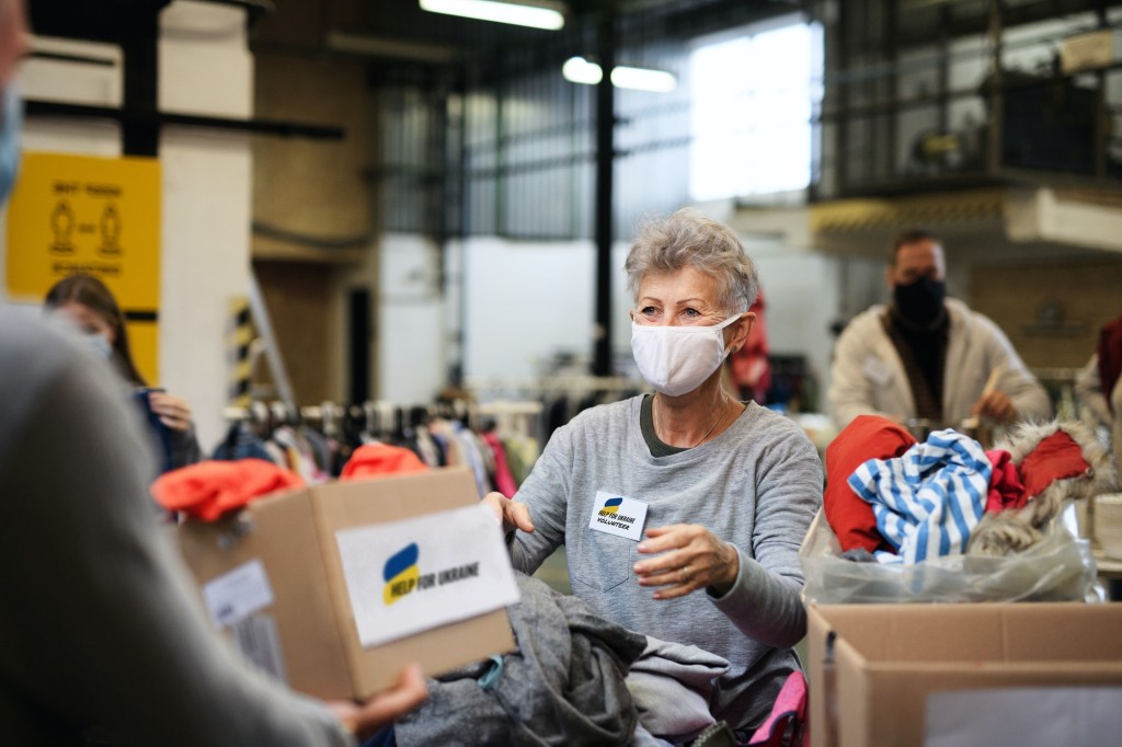Volunteers collecting donations for the needs of Ukrainian migrants, humanitarian aid concept