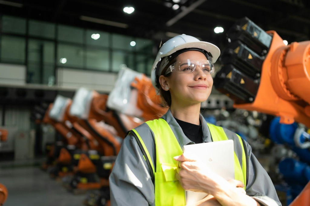 Portrait of female engineer with the mission of auditing, testing, improving software